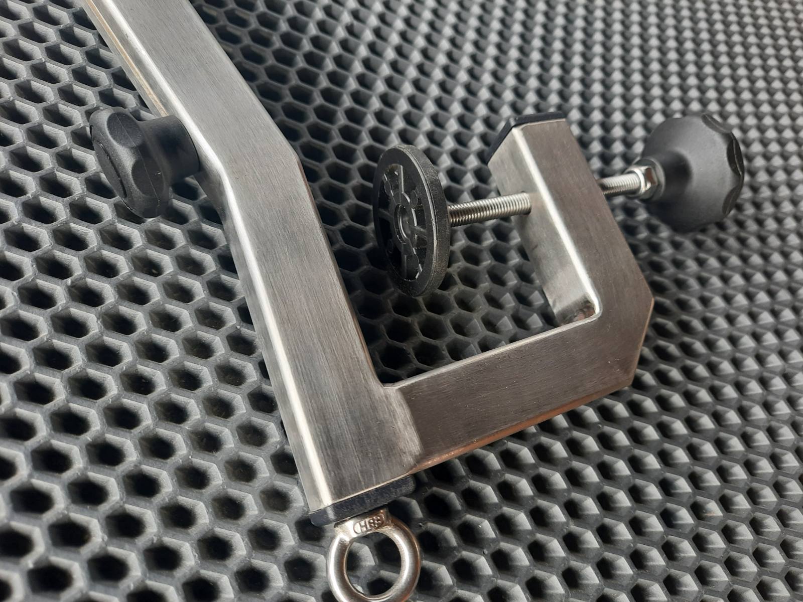 Clamp for installing large echo sounder sensors on PVC boats with a low-pressure inflatable bottom and an interceptor